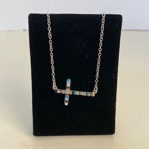 Z145 New adjustable choker that is silver with multi colored beans in cross.